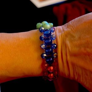 Handmade stretchy bracelet with green, red, blue pearl beads and sparkly beads